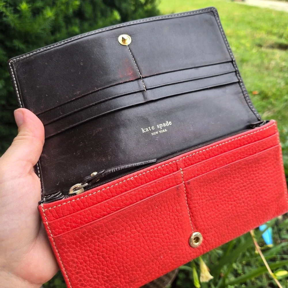 kate spade bifold pebble leather wallet. In red. Flaws